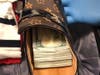 The traveler also carried some of the money in his shoes.
