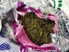 The a green leafy material was wrapped in foil bundles inside 18 boxes of a variety of "African fabric."