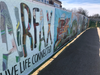 On Saturday, Fairfax City officials unveiled 250 feet of murals that seven students from Mrs. PJ Naber's digital arts class at Fairfax High school created  to decorate the Boulevard VI construction fence along Fairfax Boulevard. 