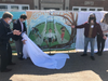 From left, Mayor David Meyer, IDI Managing Director Enrico Cecchi, Austin Eilbert, and Mrs. PJ Naber unreal Eibert's mural inspired by nature.