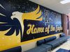 In preparation for Friday's ceremony, the City of Fairfax Schools added Katherine Johnson's name to the outside of the building and painted murals in the school's main hallway.