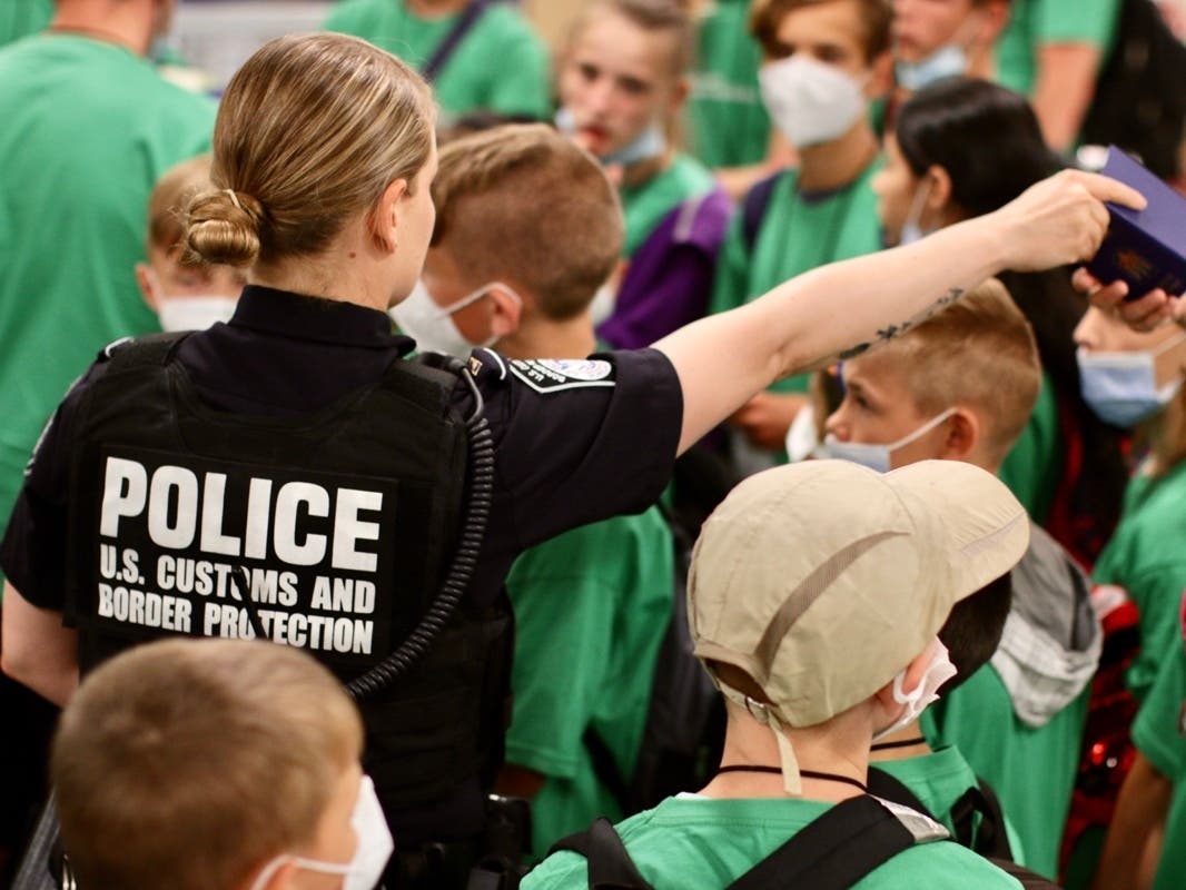 U.S. Customs and Border Protection officers helped 65 orphans from Latvia and the Ukraine navigate the international arrival process. 