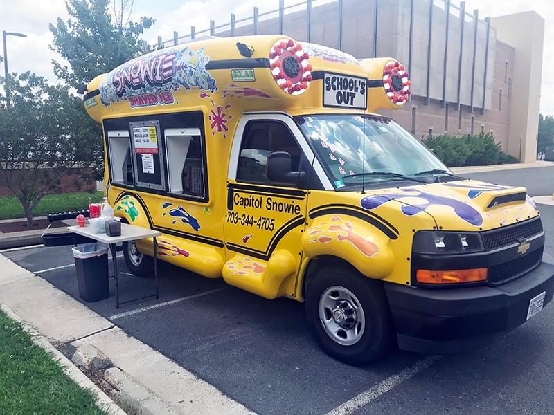 On Friday, Michael Ruelas had set up his Capitol Snowie​ truck and was selling frozen treats to passersby at the Providence Community Center at 3001 Vaden Drive in Fairfax.