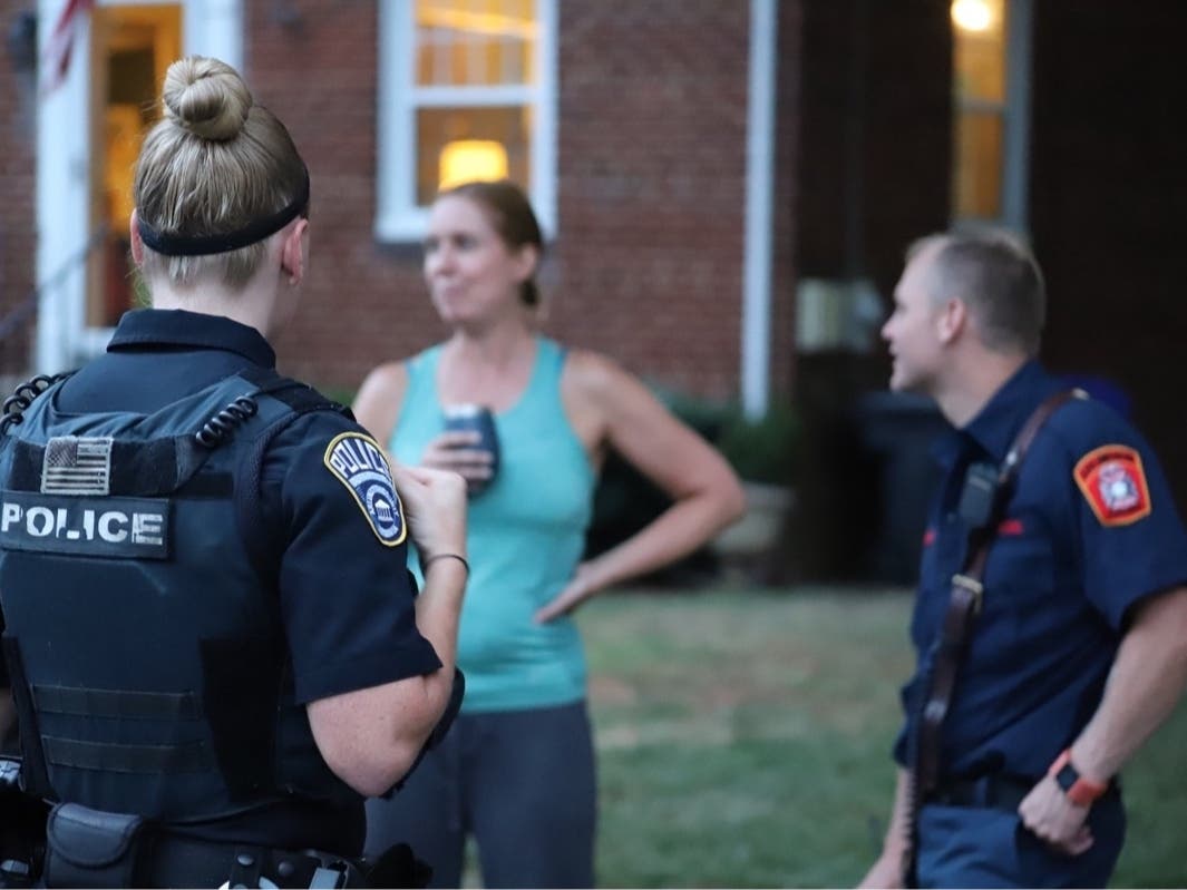 Arlington police officers talk to a resident during National Night Out on Aug. 7, 2019 