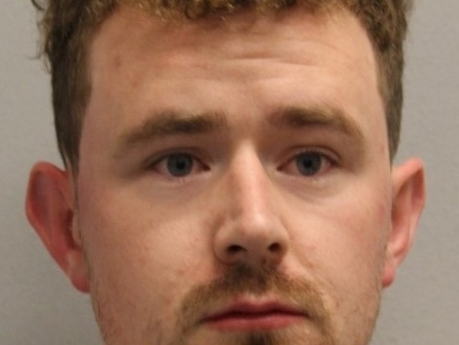 Delaware State Police arrested 26-year-old Thomas J. Obrien of Arlington with burglary after they found him asleep in a Rehoboth home.