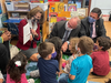 Virginia First Lady Pamela Northam reads a story on Friday to children at the Main Street Child Development Center in Fairfax City, as U.S. Sen. Tim Kaine (Virginia) and Del. Dan Helmer (40th District) look on.