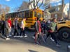 Yorktown High School students board buses that will take them to the Knights of Columbus on Little Falls Road. The students were being evacuated after the school was put on lockdown following a telephone threat.