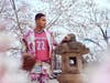 Surrounded by cherry blossoms, Wizards forward Kyle Kuzma shows off his 2022-23 City Edition uniform.