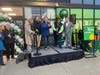 From left, Councilmember D. Thomas Ross, Councilmember Jon R. Stehle Jr., Mayor David Meyer, Fairfax Amazon Fresh Manager Tiffany Pressley, and Councilmember Sang H. Yi cut the ribbon at Thursday's grand opening.