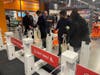 Amazon Fresh employees help customers use the Just Walk Out scanners to ring up their purchases on the grocery store's first day in the Point 50 shopping center in Fairfax City.