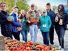 From left, Volunteer Korinne Wills; Market Manager Fran Lovaas; FCPA Marketing Coordinator Molly Cullen; RFM Founder John Lovaas; Market Manager Anne Strange; Park Authority Chairman and Reston Resident Bill Bouie; and Volunteer Kaitlyn Pinero Mendoz