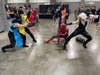 A group of costumed superheroes square off Saturday afternoon during the 2022 Awesome Con at the Walter E. Washington Convention Center in Washington, D.C