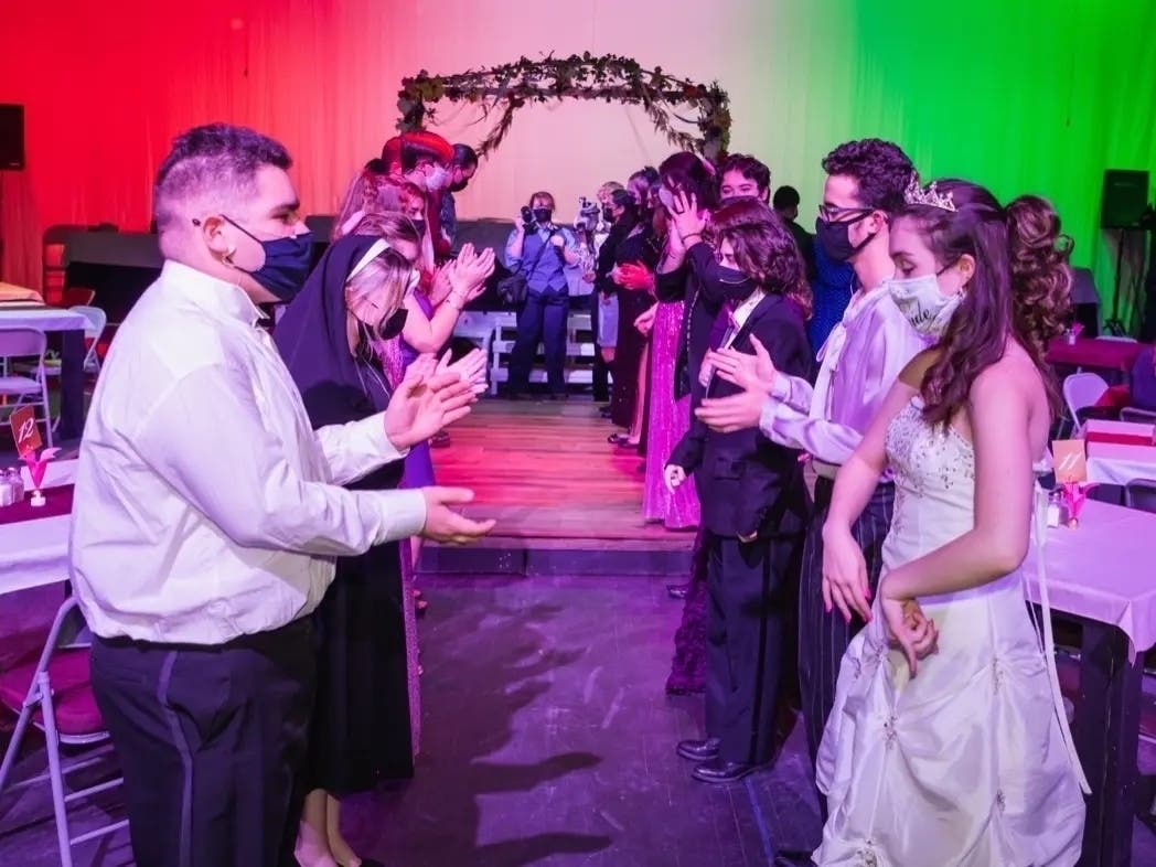 Yali Miranda (Left) Claire Callaway, ensemble, Roland Lamoureux, and Lulu Megahed star in Herndon High School's Nov. 20 performance of "Tony n' Tina's Wedding."
