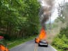 Two people face multiple charges in connection with a series of home and car fires that occurred between April and June. In this photo from June 21, an Infiniti sedan is burning on Southdown Lane near Avery Road.