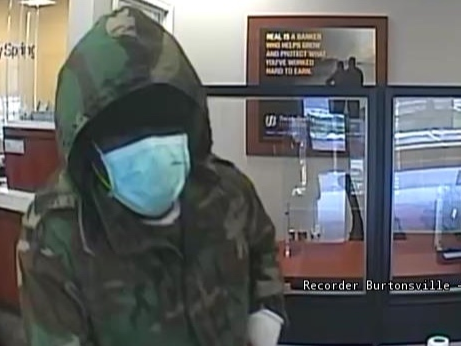The suspect wore one black glove and one blue latex glove in all three robberies. He also passed a note saying he had a gun and bomb.