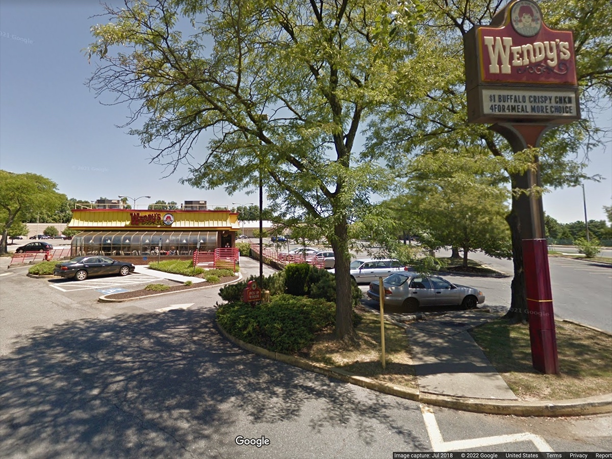 Police release a surveillance video showing a man lunging for and stealing a cash register from a Aspen Hill Wendy's restaurant.