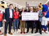 During its opening grand ceremony, the Giant Food in Silver Spring presented a $3,000 check to Manna Food Center​, which provides food for the hungry in Montgomery County.
