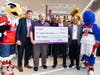 During its opening grand ceremony, the Giant Food in Silver Spring presented a $3,000 check to Impact Silver Spring​,​ which advocates for racial equity, justice and liberation.
