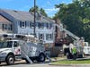 Verizon work crews spent much of Thursday replacing telephone lines and poles along Herndon Parkway.