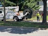 On Thursday afternoon, Verizon workers reel-in telephone cable as a nearby crew works to connect the cable to a new telephone pole on Herndon Parkway.