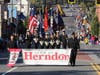 The Herndon High School NJROTC color guard leads the school's homecoming parade down Elden Street on Saturday morning. 