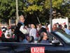 Herndon Mayor Sheila Olem rides in the back of a convertible in Saturday's parade.