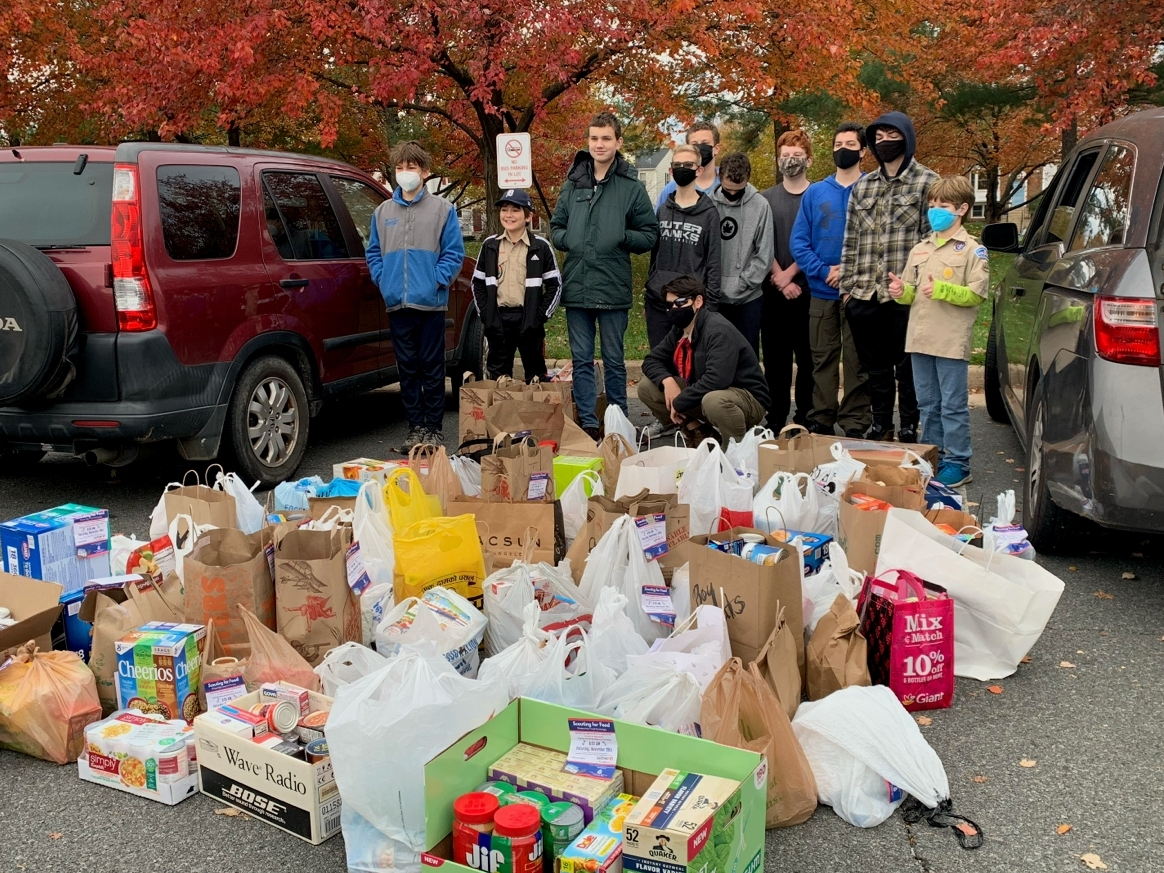 Scouts from Troop 159 with food they collected in 2021 for Scouting for Food.