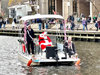 Santa Claus arrived in style Saturday aboard a pontoon boat on Lake Anne in Reston.