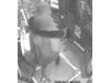 The suspect wore a black ski mask, black coat with fur around the hood, black jeans and black shoes.  