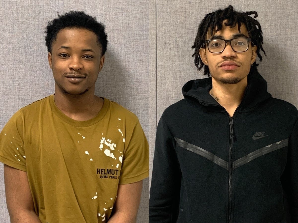 Montgomery County Police took Kajohn McCombs, left, and Ahmahd McCombs of Capitol Heights into custody Tuesday in connection with the March 5 fatal shooting of Deandre Keith Ellis in Silver Spring.