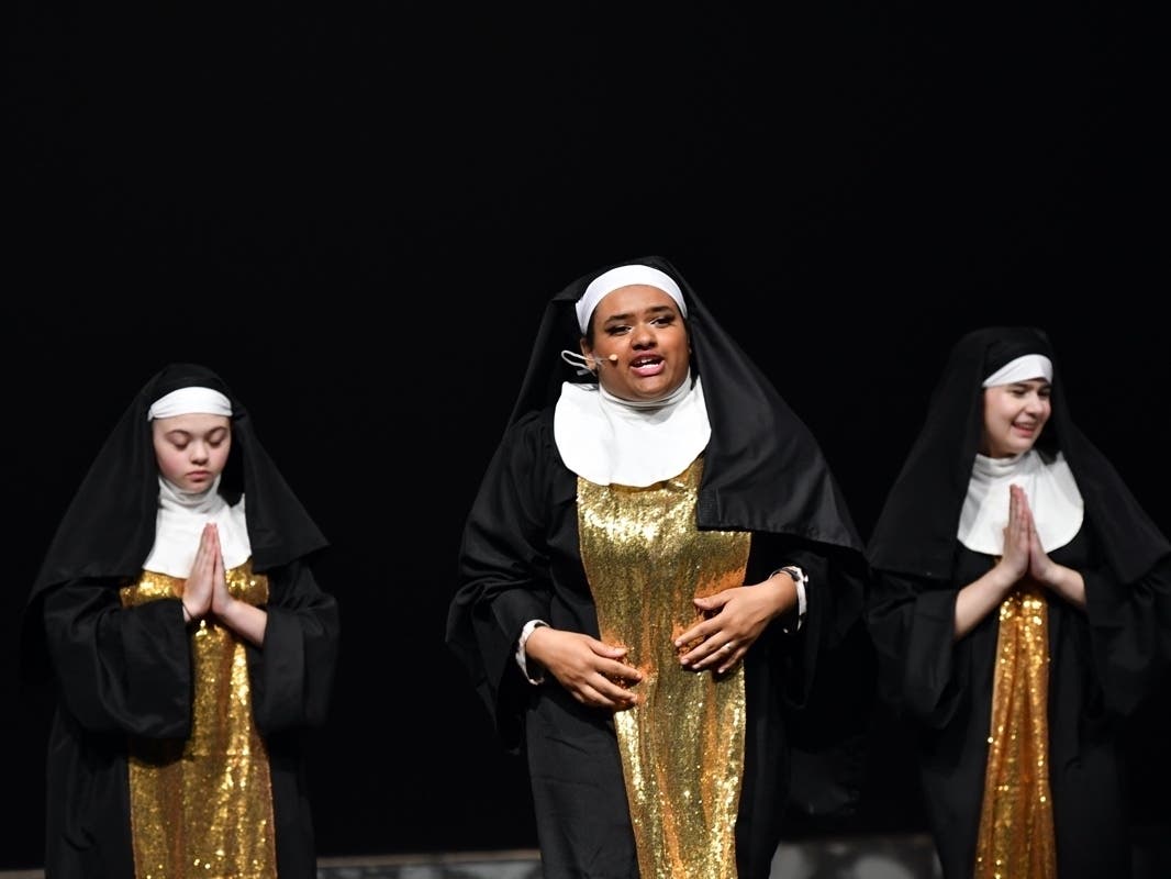 From left, Lilou Shaw, Isabella Jackson, and Ava Bjork perform in Fairfax High School's April 28 production of "Sister Act."