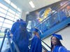 Fairfax High Schools participating in the graduation walk head up the stairs at Katherine Johnson Middle School on Monday morning.