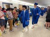 Graduating seniors from Fairfax High School are cheered by students lining the hallways of Katherine Johnson Middle School on Monday as part of the annual graduation walk, in which the seniors visit all schools in the FHS pyramid.