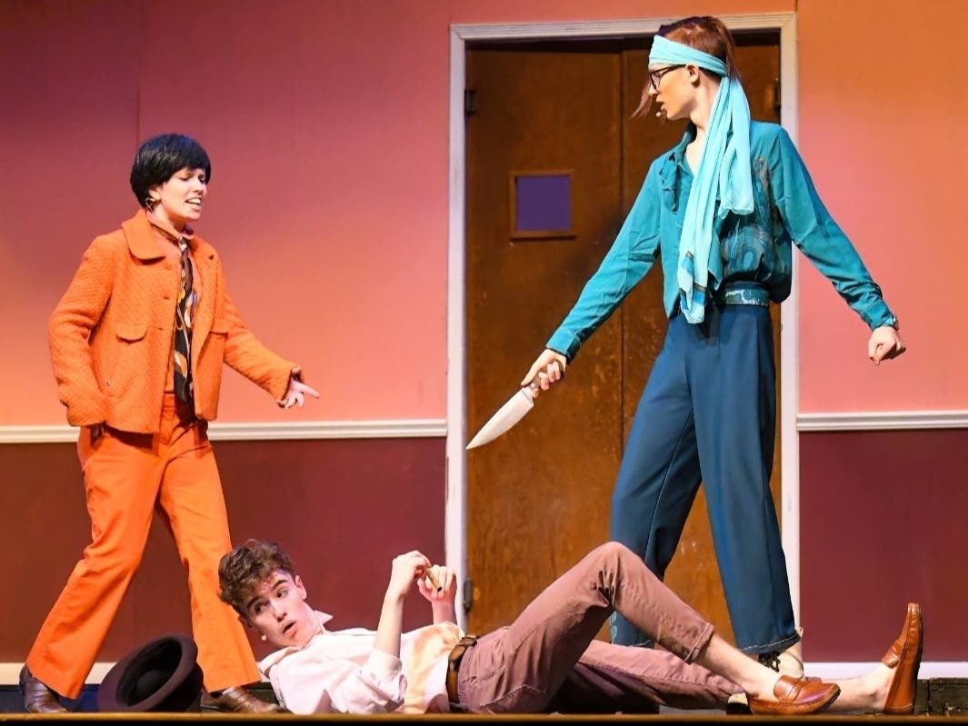 From left, Alyce Visioli, Ian Conner and Peter Gardner perform in W.T. Woodson High School's production of "One Man, Two Guvnors." Fellow cast members Charlotte Willmore and Silas Blocker won Cappies Awards for their roles in the play.