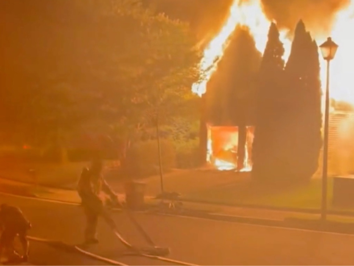 Firefighters work to extinguish a two-alarm fire that caused an estimated $1,068,000 in damage to a home in the Fair Oaks area on Tuesday night.