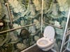 The interior of the Throne unit installed at Old Town Square is decorated in a tropical motif.