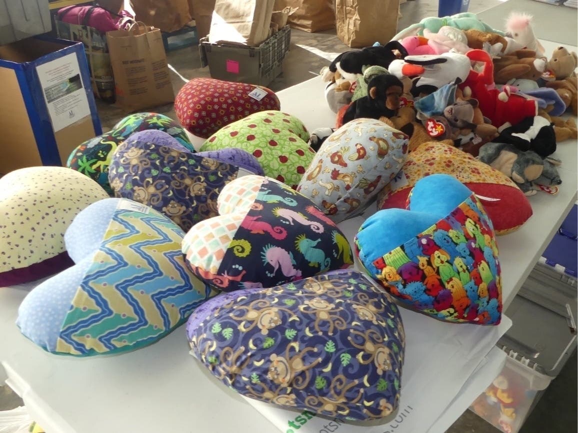 The Dunbarton Hugs Team in Bristow​, Virginia makes the pillows for the Assistance League. 