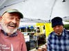 John Lovaas (left) takes a selfie with one of the market's 34 vendors. 