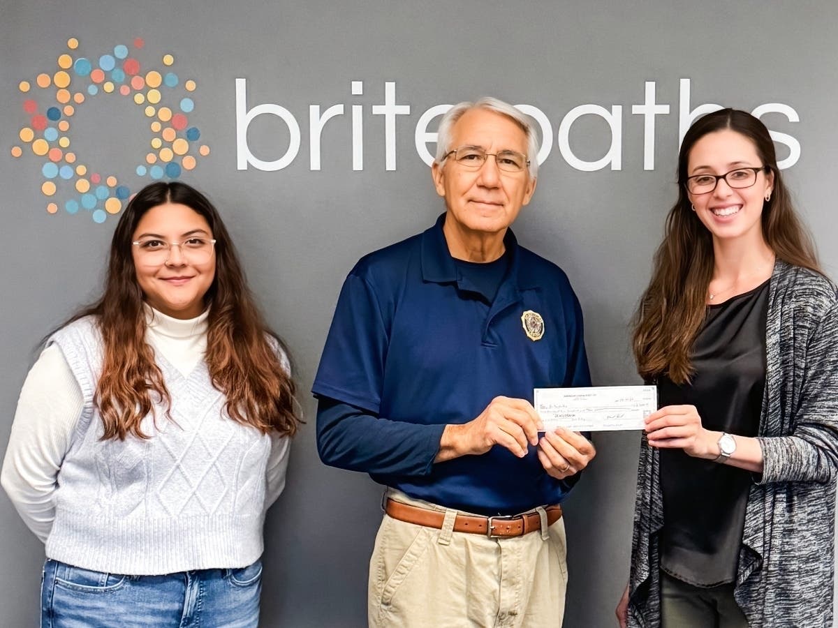 American Legion Post 177 in Fairfax is sponsoring Britepaths’ Holiday Program for a third year. On Oct. 18, the Post’s Finance Officer Mike Kimlick (center) presented Britepaths’ staff with a check for $2,500.