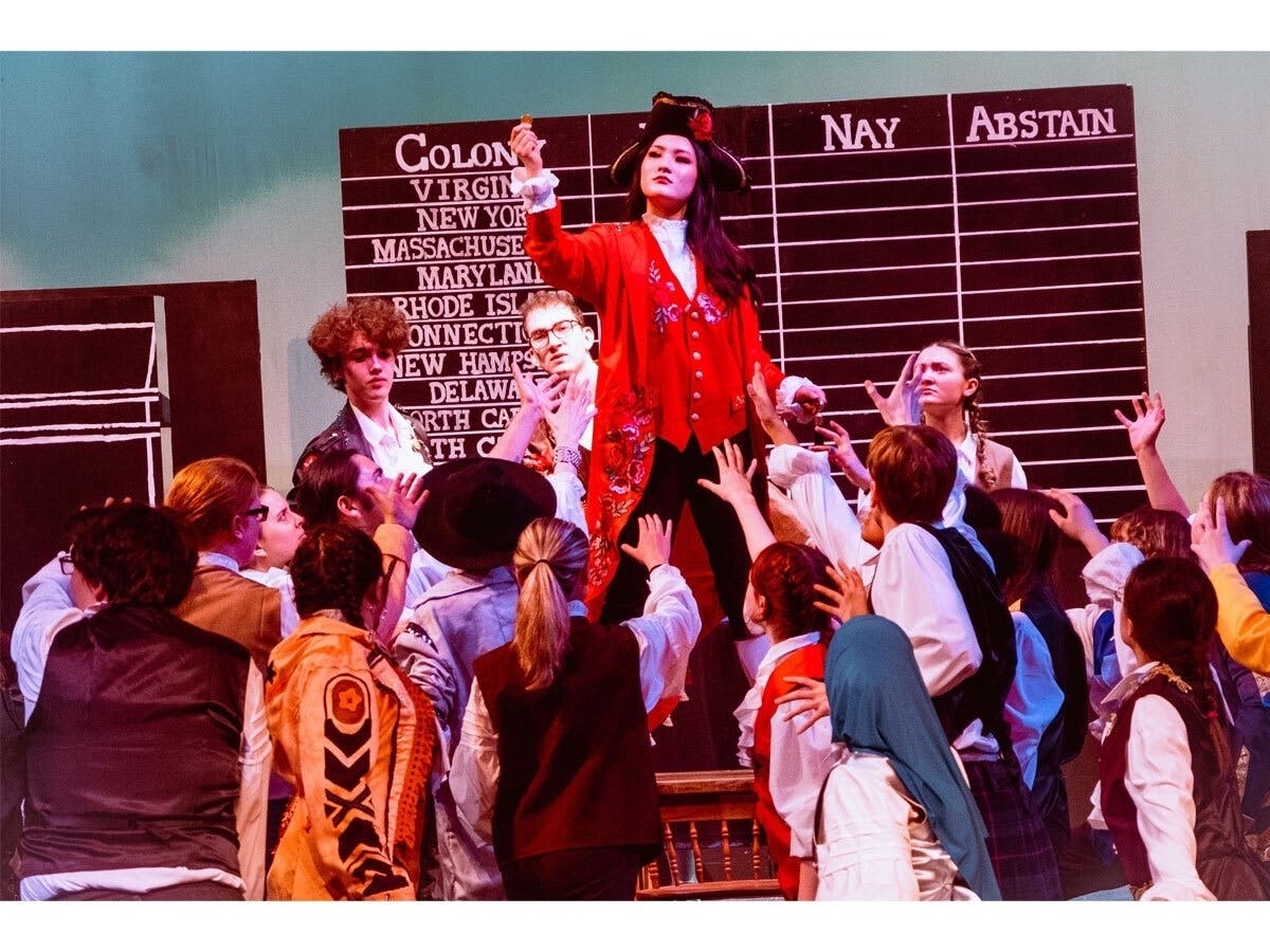 From left, Ian Conner, Jonah Hilbert, Haley Kim, and Julie Gurrola perform a scene from W.T. Woodson High School's production of "1776" the musical.