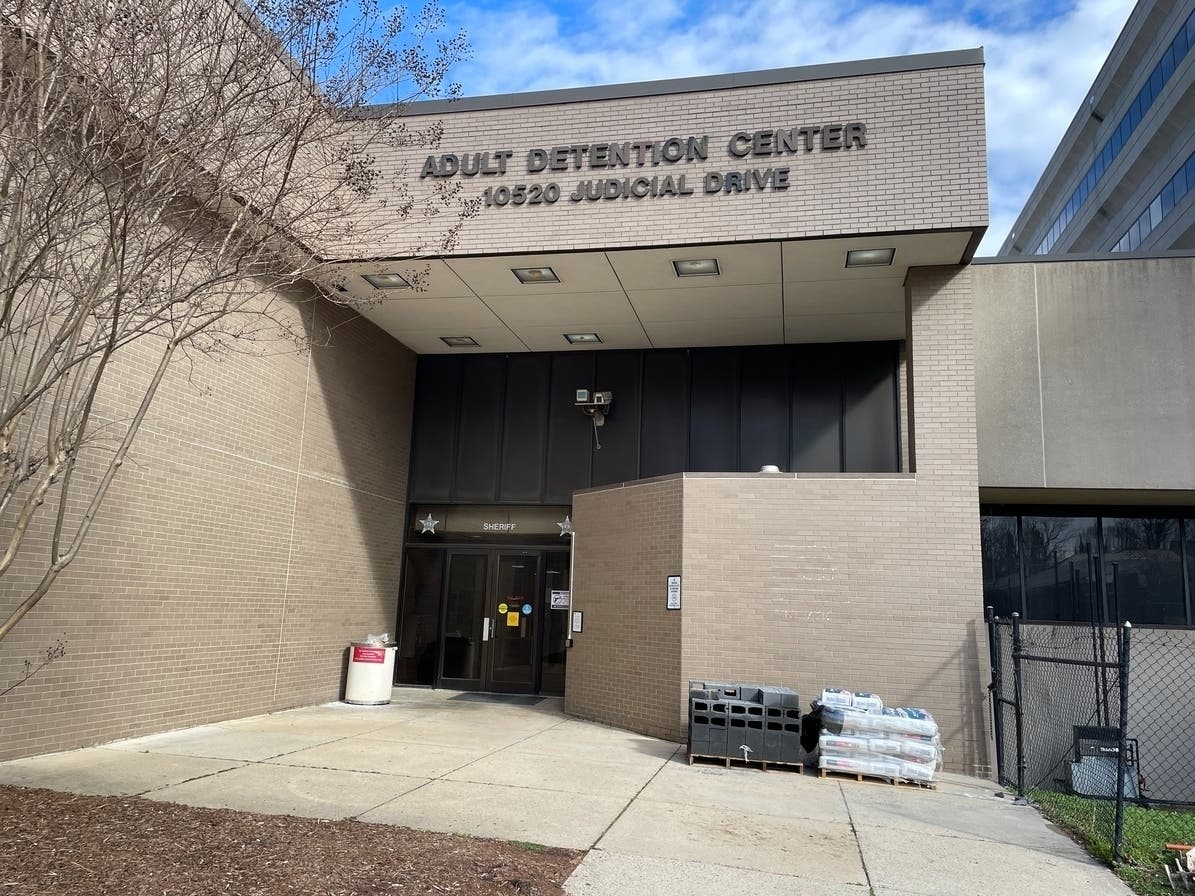 A former sheriff's deputy was charged in connection with an assault on an inmate at the Fairfax County jail in January. 
