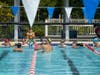 During Monday's clinic, U.S. Olympian Cody Miller gets in the pool to demonstrate different techniques to the young swimmers from Herndon.