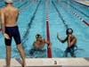 Cody Miller give a high-five to one of the swimmers at Monday's clinic at the Kingston Chase pool.