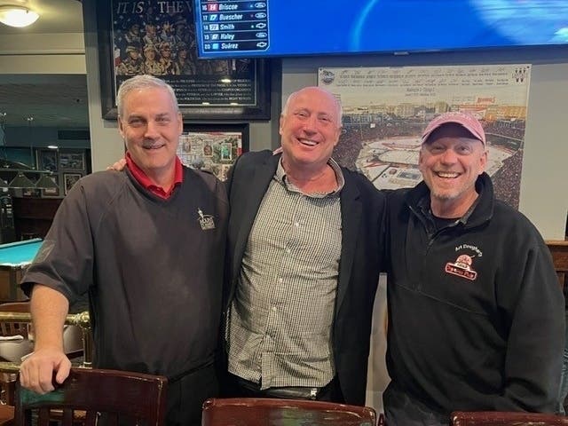 Crystal City Sports Pub owners (From Left) Jimmy Madden, Billy Bayne Jr. and Art Dougherty pose for a photo in their restaurant, which recently celebrated its 30th anniversary.