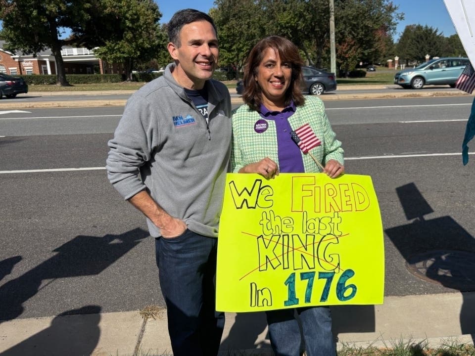 Del. Dan Helmer (D-Fairfax Station) poses for a photo with then Braddock District Supervisor Candidate Rachna Sizmore Heizer (D) during a No Kings Protest on Oct. 20, 2025 along Braddock Road in Fairfax. 