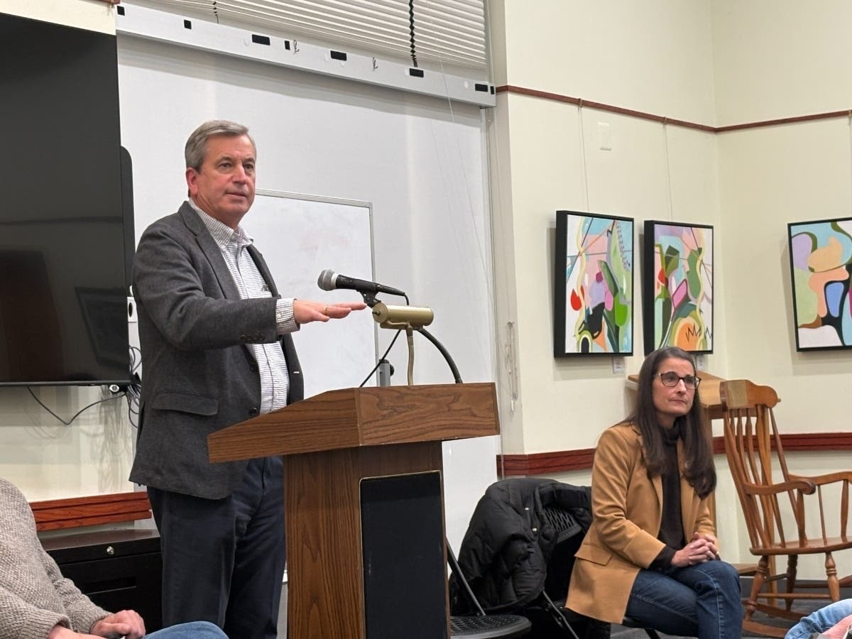 Del. Rip Sullivan (D-Great Falls), left, speaks to constituents during a Jan. 5 town hall meeting that he and Sen. Jennifer Boysko (D-Herndon) hosted in the Great Falls Library.