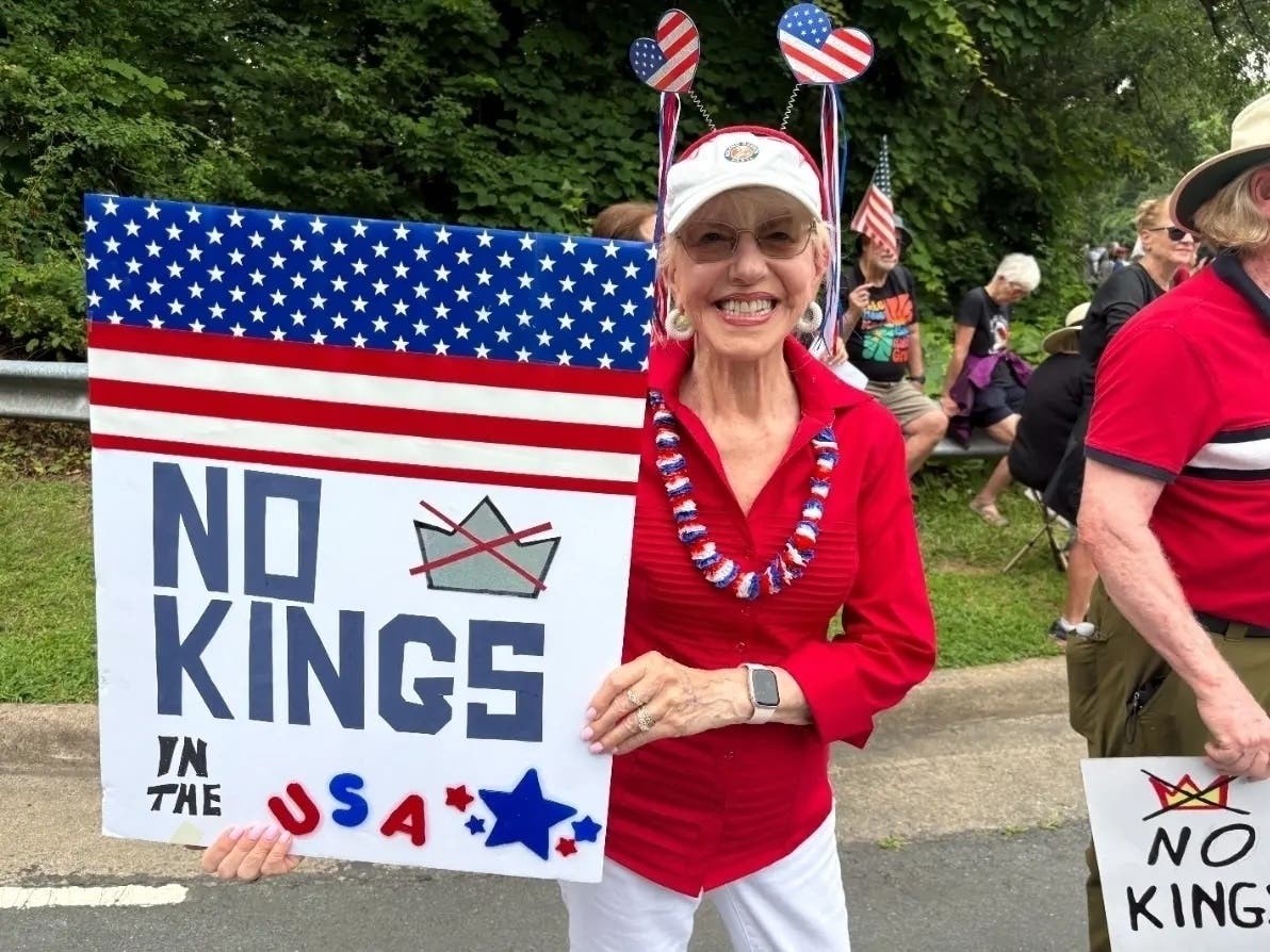 A woman makes her opinion known during a No Kings protest on Oct. 28, 2025.