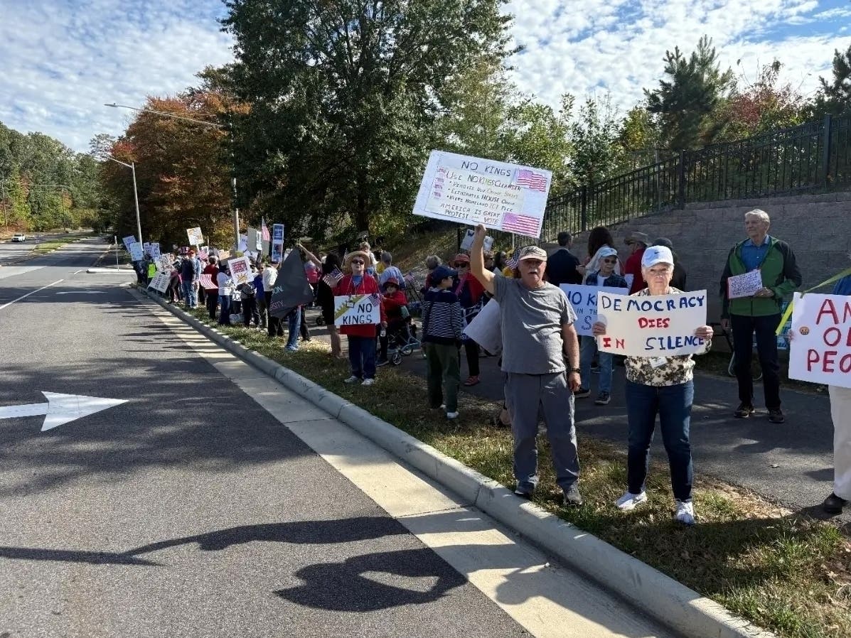 A large crowd of protesters line Braddock Road in Fairfax last October as part of a No Kings rally organized by the Woodleigh Chase Democrats.