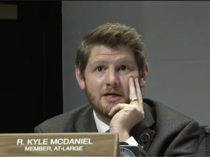 School Board member Kyle McDaniel (At-Large) introduced a motion at Thursday night's board meeting to direct the superintendent to draft a proposal for pursuing the sale of naming rights for school athletic facilities.