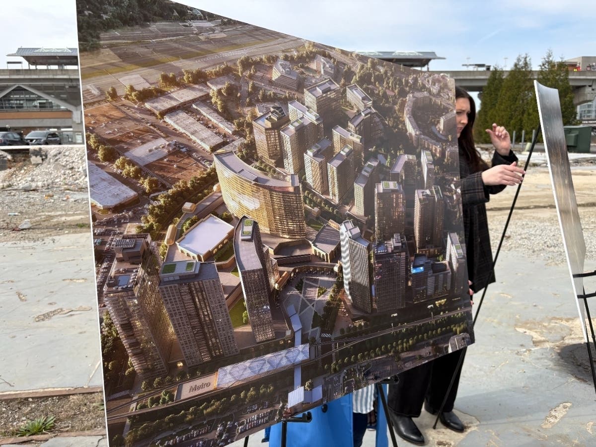 Conceptual drawings of Comstock Holding Company's entertainment district were on display during the March 25 rally by union makers at the site of the proposed casino near the Spring Hill Metro Station.